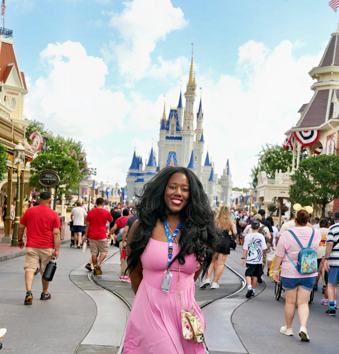 Victoria in a pink dress in front of Cinderella Castle at Magic Kingdom